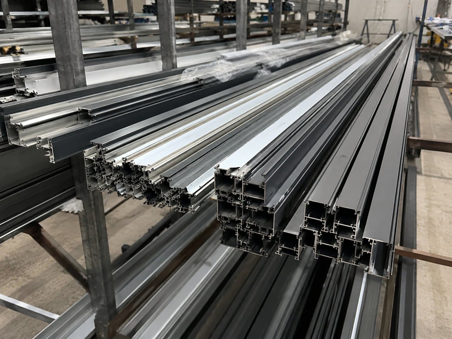 Aluminium profile stock racked in the fabrication workshop